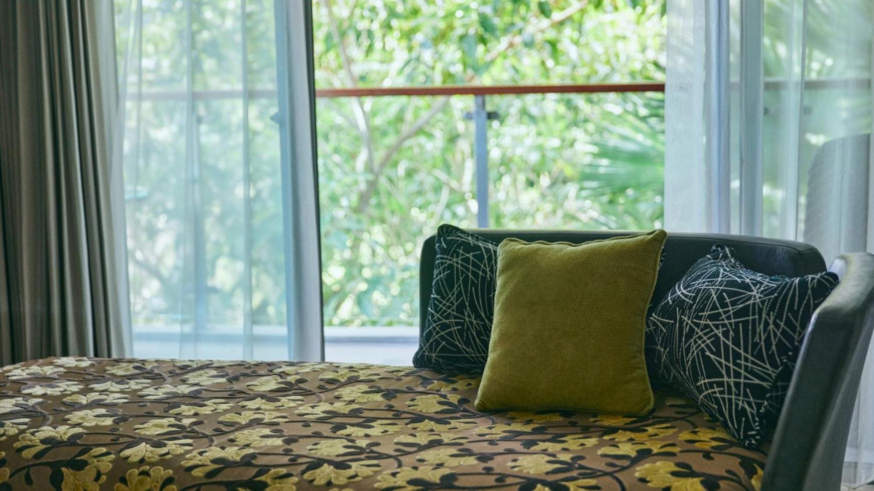 Hotel Rimba By Ayana Bali Jimbaran Exterior foto A throw pillow on a sofa